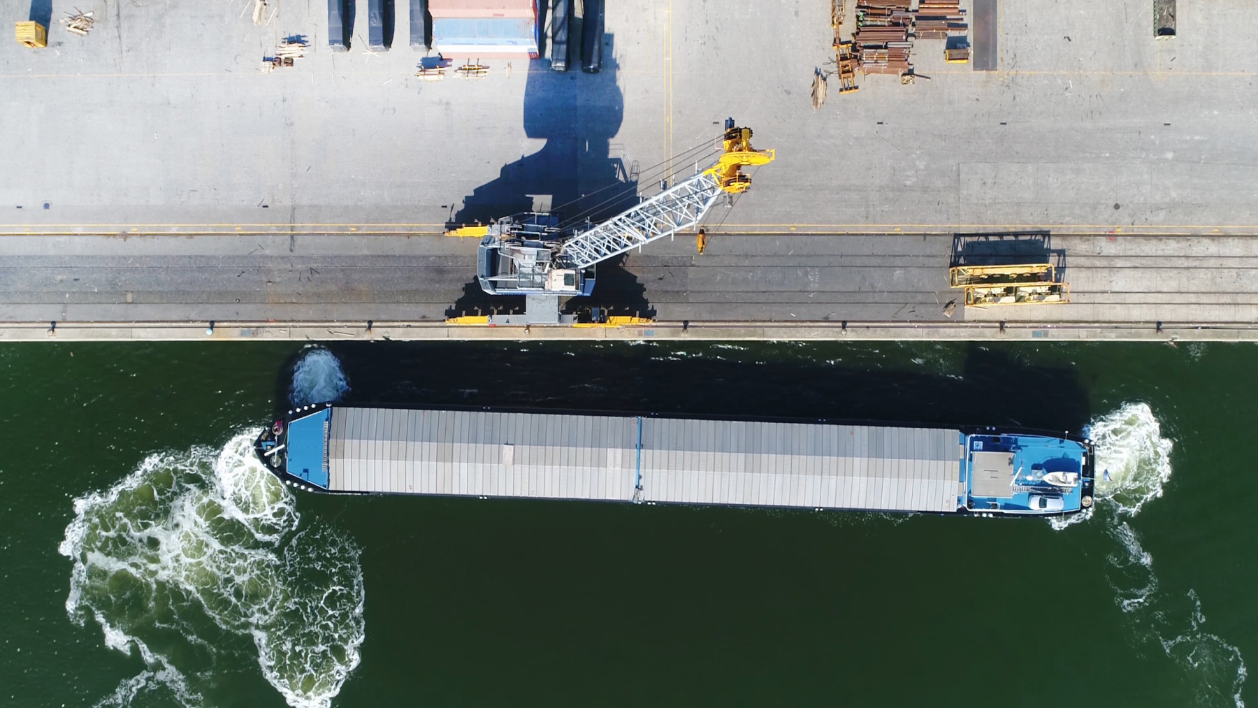 Aerial,Top,Down,Photo,Of,Barge,Docking,At,Harbor,Using
